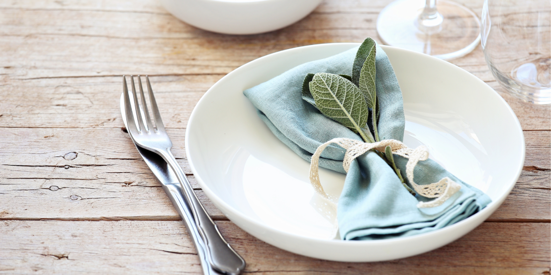 teal place setting on wooden table